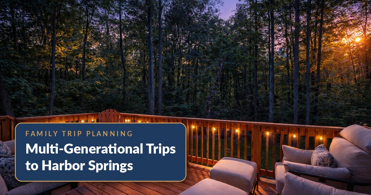 String-lit back deck at The Bird House vacation rental in Harbor Springs, Michigan at dusk — the evening gathering spot on a multi-generational family trip