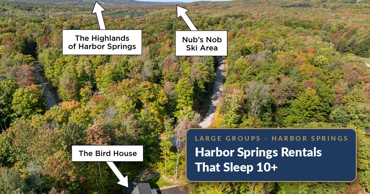 Aerial view over The Bird House in the woods near Harbor Springs, Michigan, with The Highlands and Nub's Nob ski areas labeled on the horizon - a private house that sleeps 11